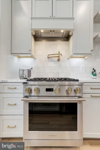 a kitchen with sink cabinets and window