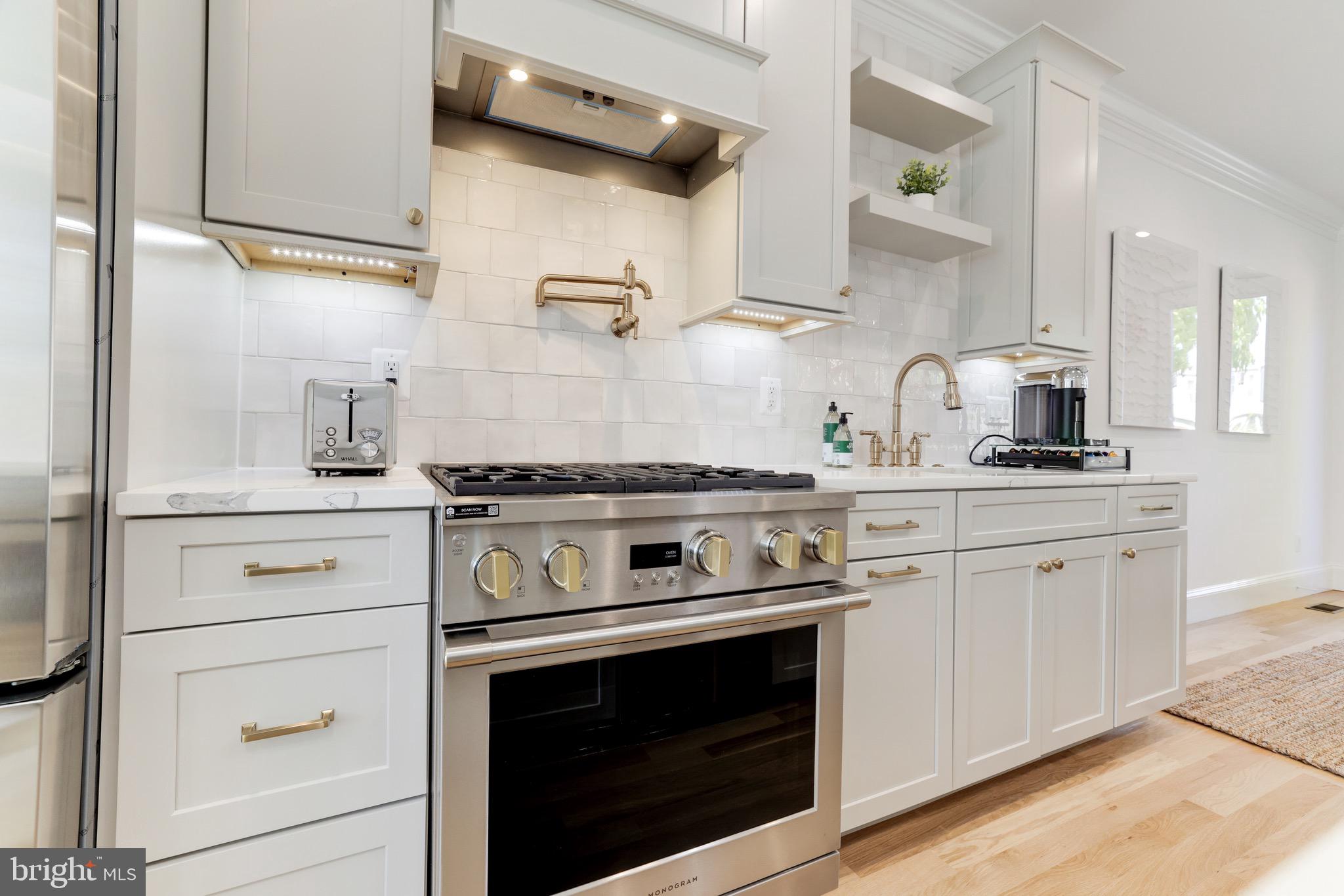 1415 Princess Street Alexandria, VA 22314 - Photo 20 of 63 a kitchen with stainless steel appliances granite countertop a stove and a sink