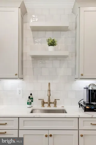 a view of a dining room with furniture and a window