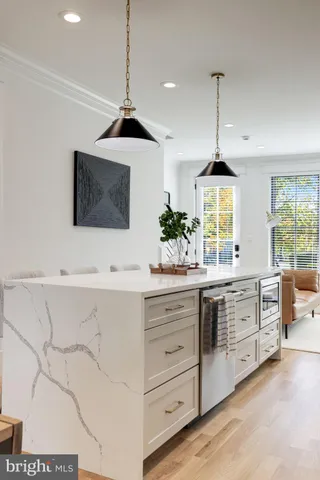 a view of a room with wooden floor and windows