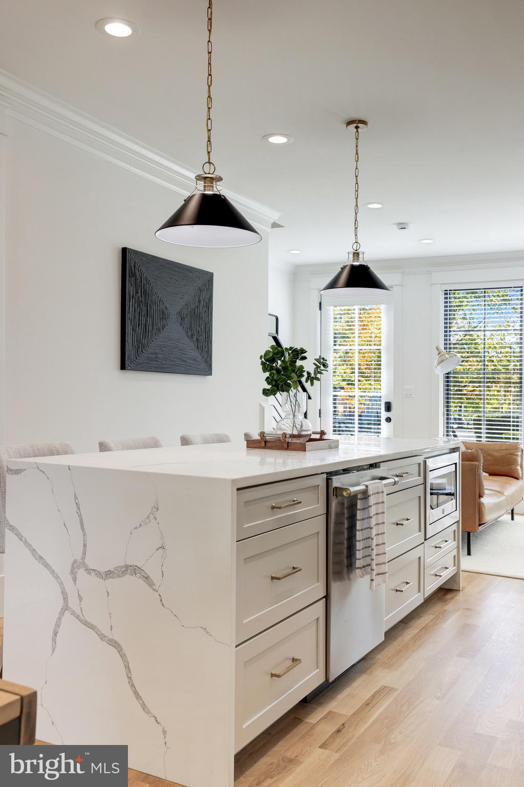 1415 Princess Street Alexandria, VA 22314 - Photo 24 of 63 a kitchen with sink cabinets and window