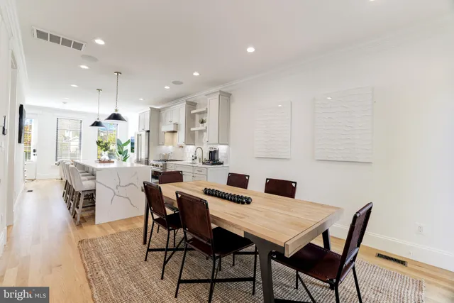 a view of a hallway with paintings on the wall
