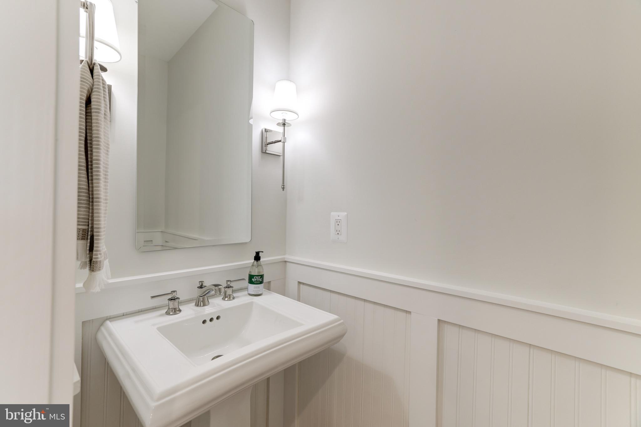 1415 Princess Street Alexandria, VA 22314 - Photo 33 of 63 a bathroom with a sink and a mirror