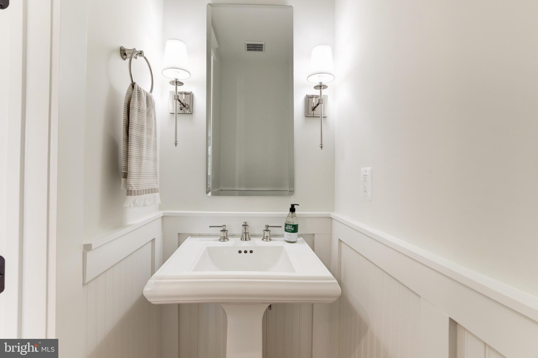 1415 Princess Street Alexandria, VA 22314 - Photo 34 of 63 a bathroom with a sink and a mirror
