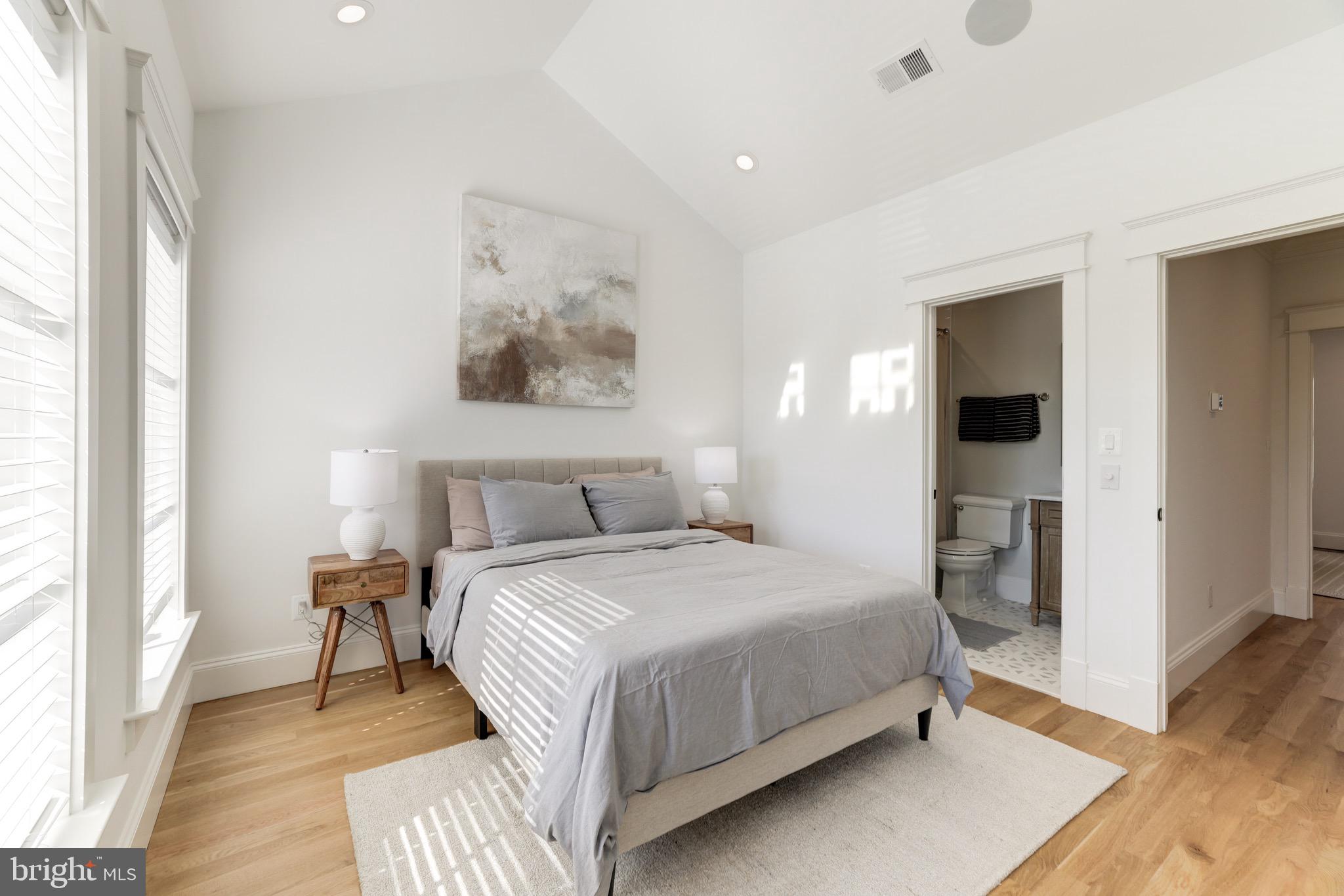 1415 Princess Street Alexandria, VA 22314 - Photo 39 of 63 a bedroom with a bed and a large mirror