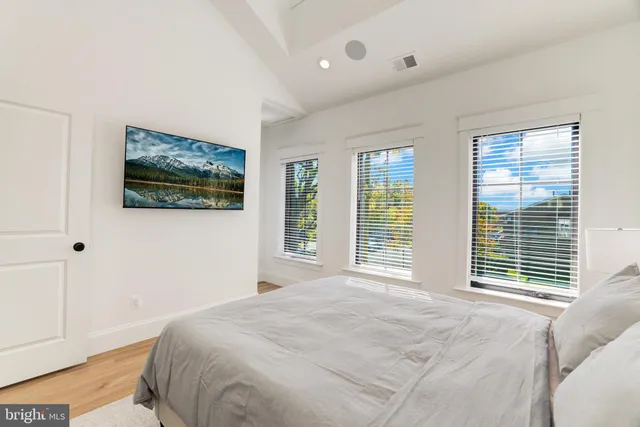 a bedroom with a bed and a couch