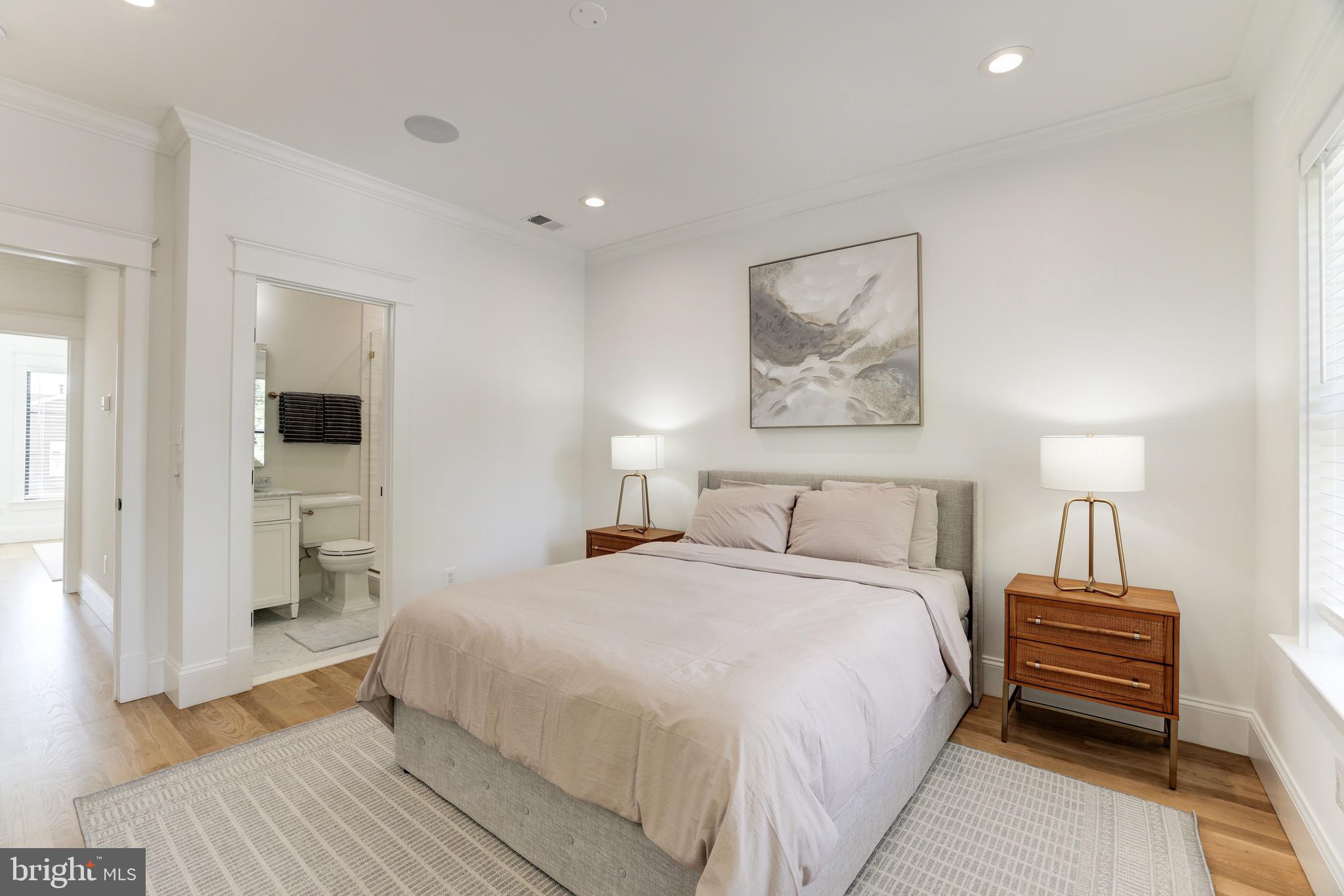 1415 Princess Street Alexandria, VA 22314 - Photo 43 of 63 a bedroom with a bed and a chandelier