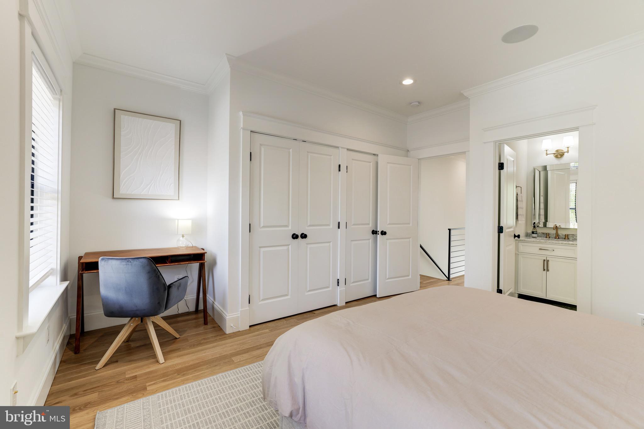 1415 Princess Street Alexandria, VA 22314 - Photo 45 of 63 a bedroom with a bed a chair and dresser