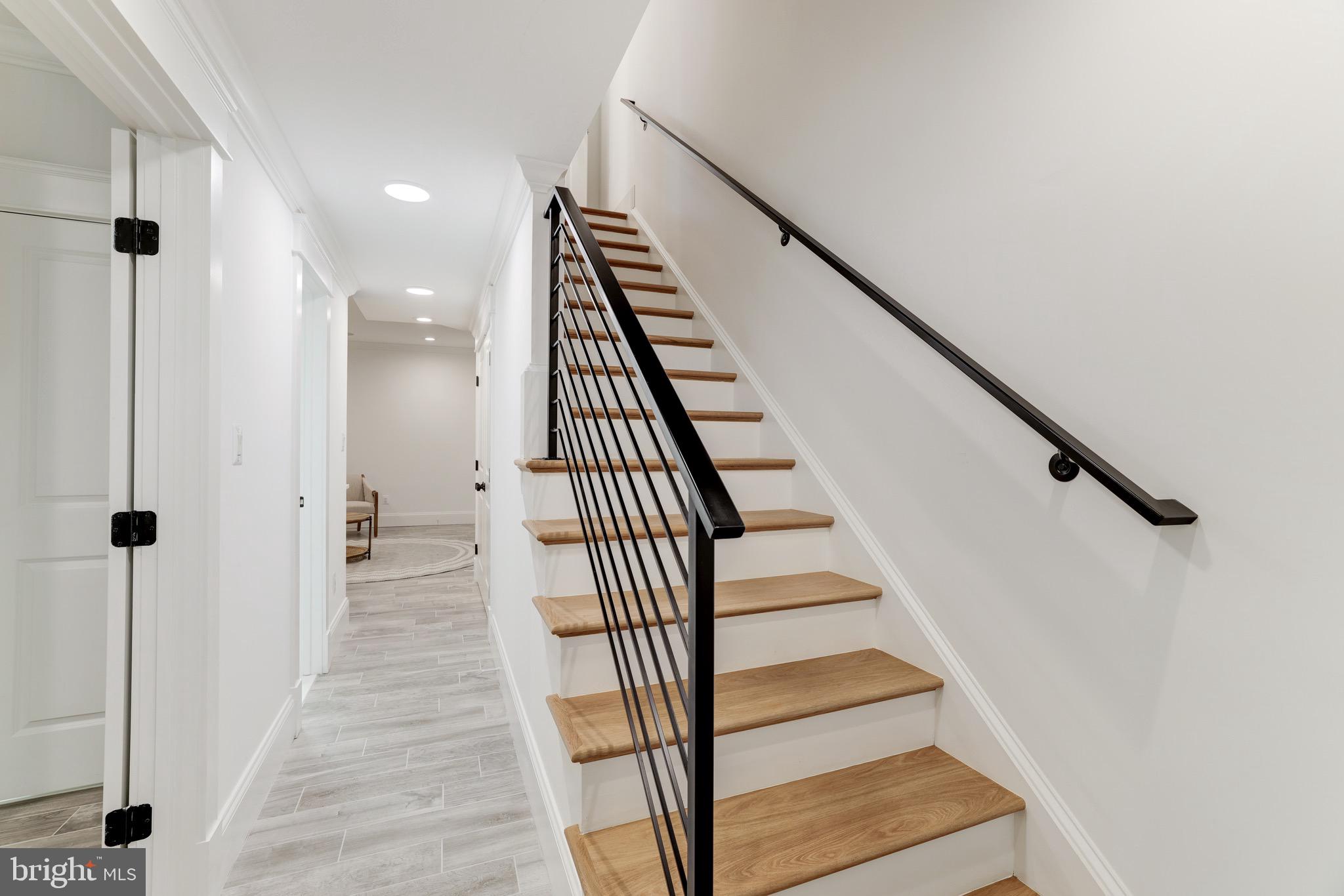 1415 Princess Street Alexandria, VA 22314 - Photo 48 of 63 a view of a hallway with wooden floor and entryway