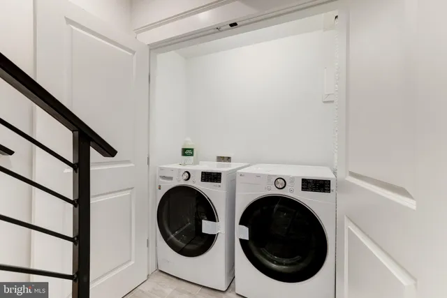 a view of an outdoor sitting area with wooden fence