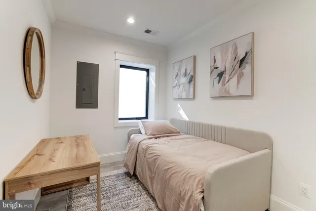 a view of a house with wooden fence