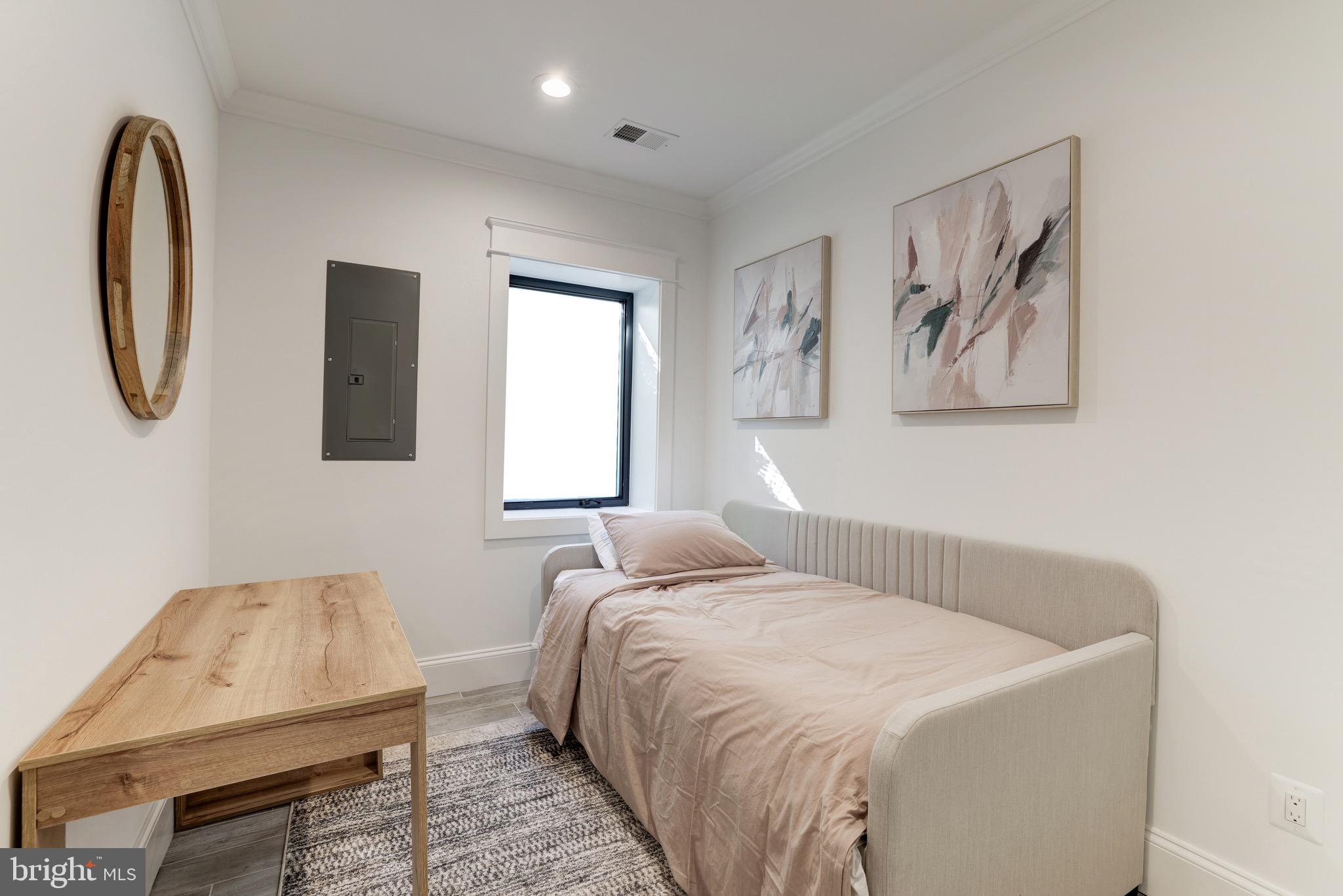 1415 Princess Street Alexandria, VA 22314 - Photo 50 of 63 a bedroom with a bed and a couch