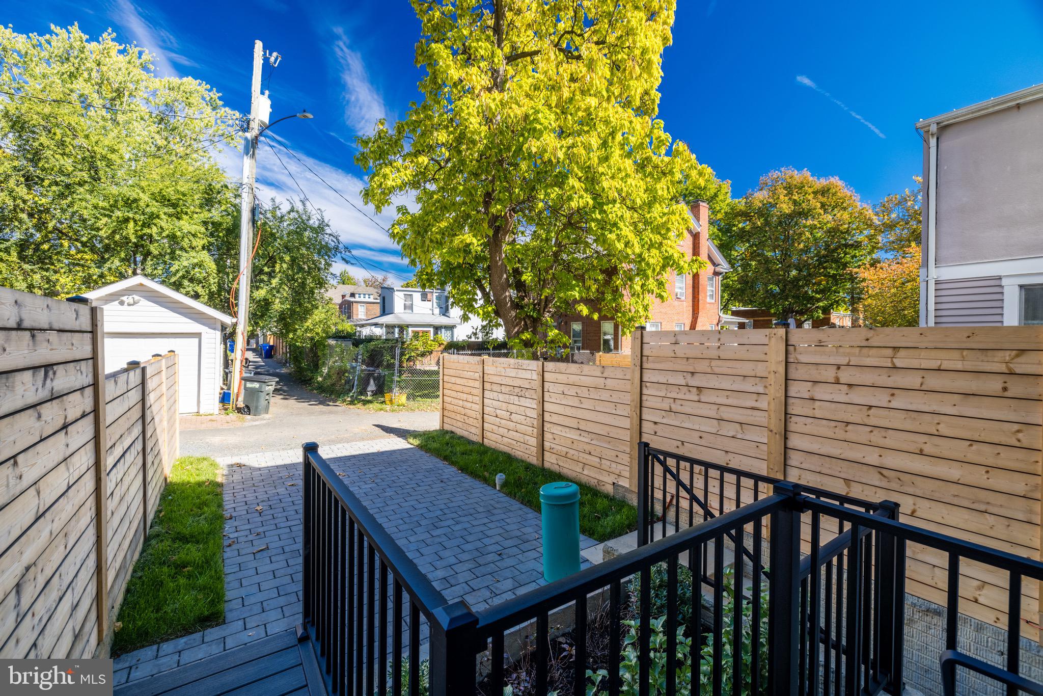 1415 Princess Street Alexandria, VA 22314 - Photo 61 of 63 a view of an outdoor sitting area with wooden fence