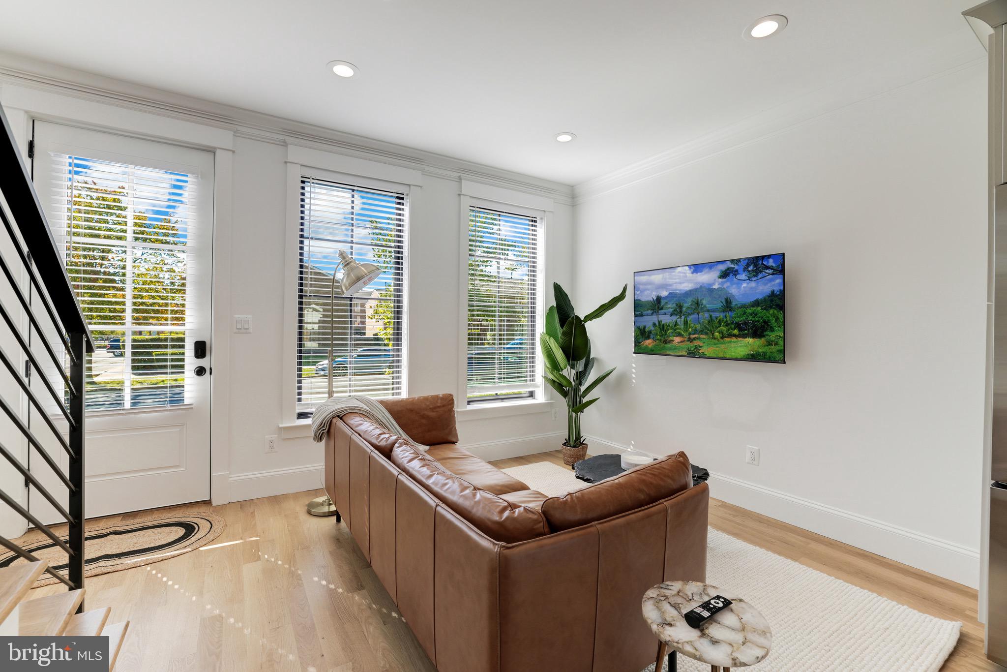 1415 Princess Street Alexandria, VA 22314 - Photo 10 of 63 a living room with furniture and a flat screen tv