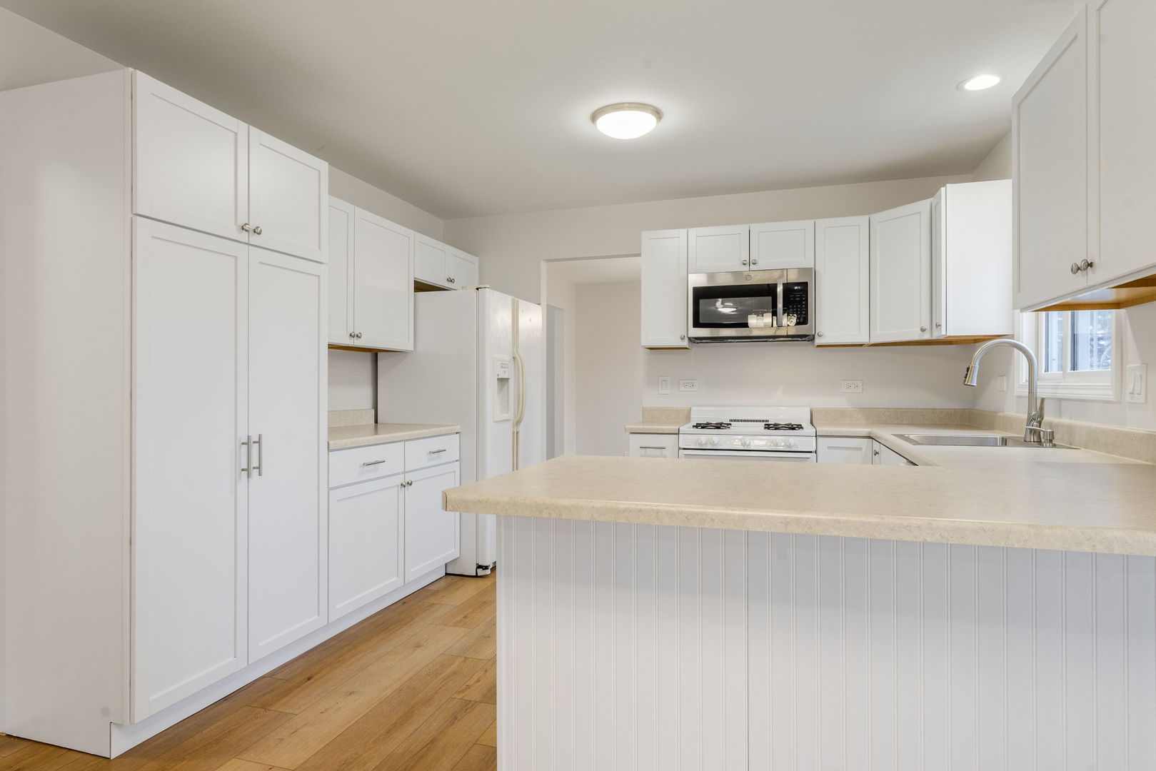 608 Carriage Hill Road Island Lake, IL 60042 - Photo 13 of 28 a kitchen with stainless steel appliances a refrigerator sink and microwave