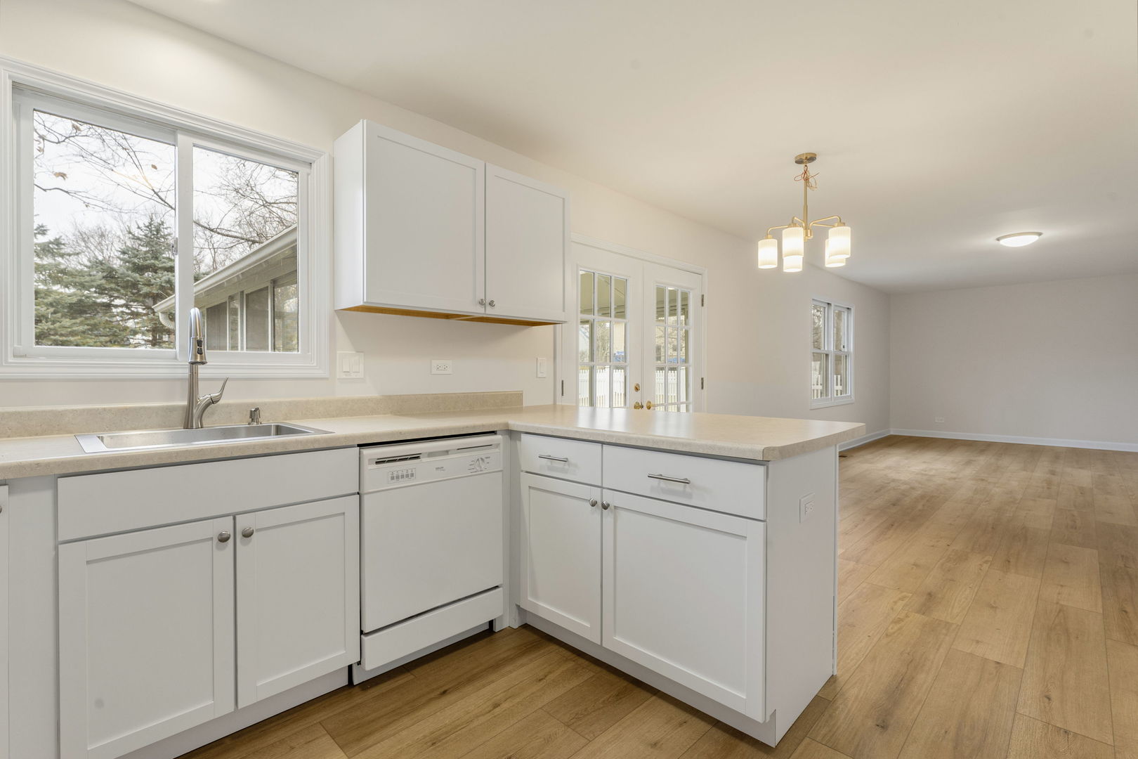 608 Carriage Hill Road Island Lake, IL 60042 - Photo 14 of 28 a kitchen with sink cabinets and wooden floor