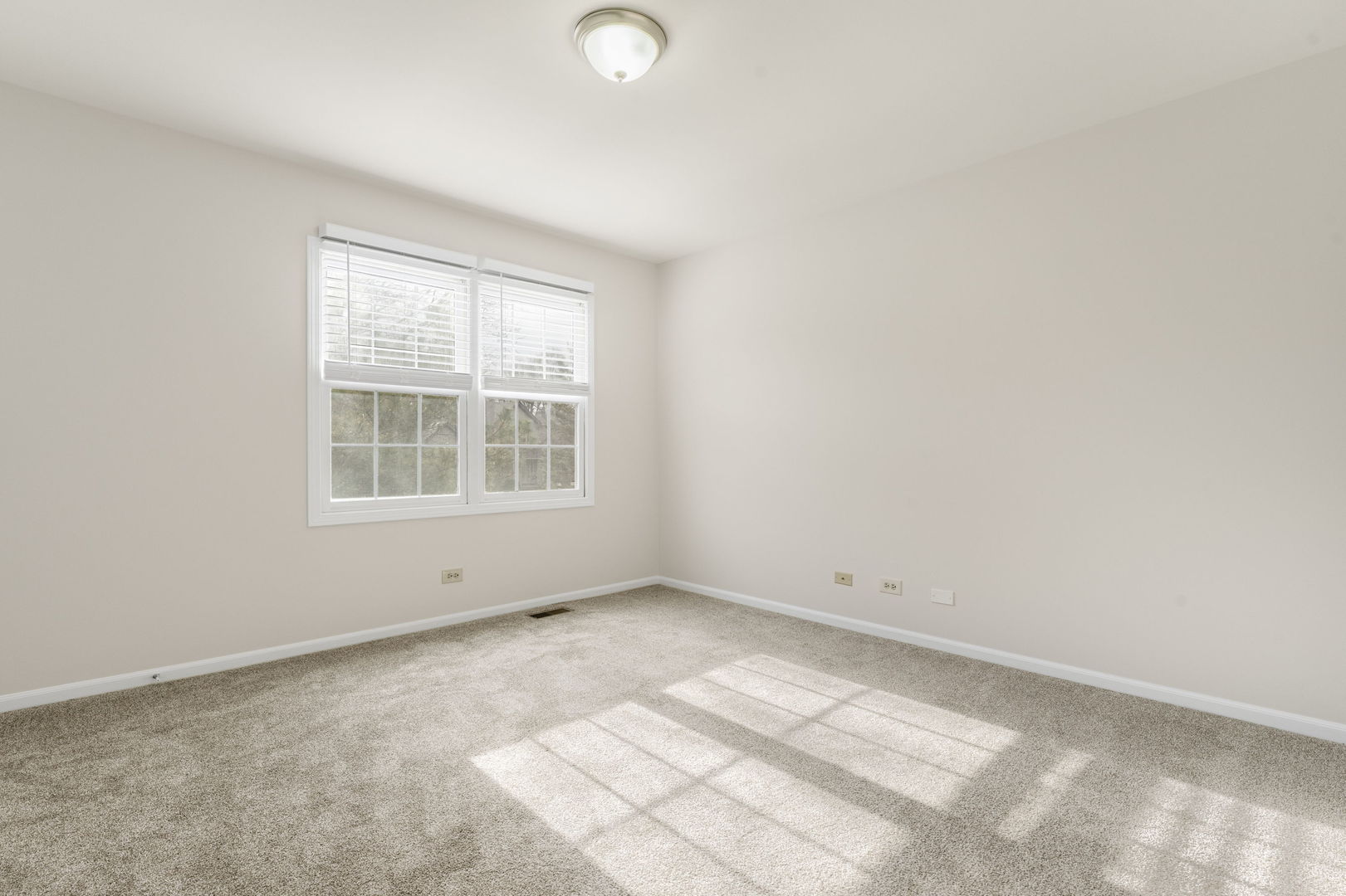 608 Carriage Hill Road Island Lake, IL 60042 - Photo 17 of 28 an empty room with a window