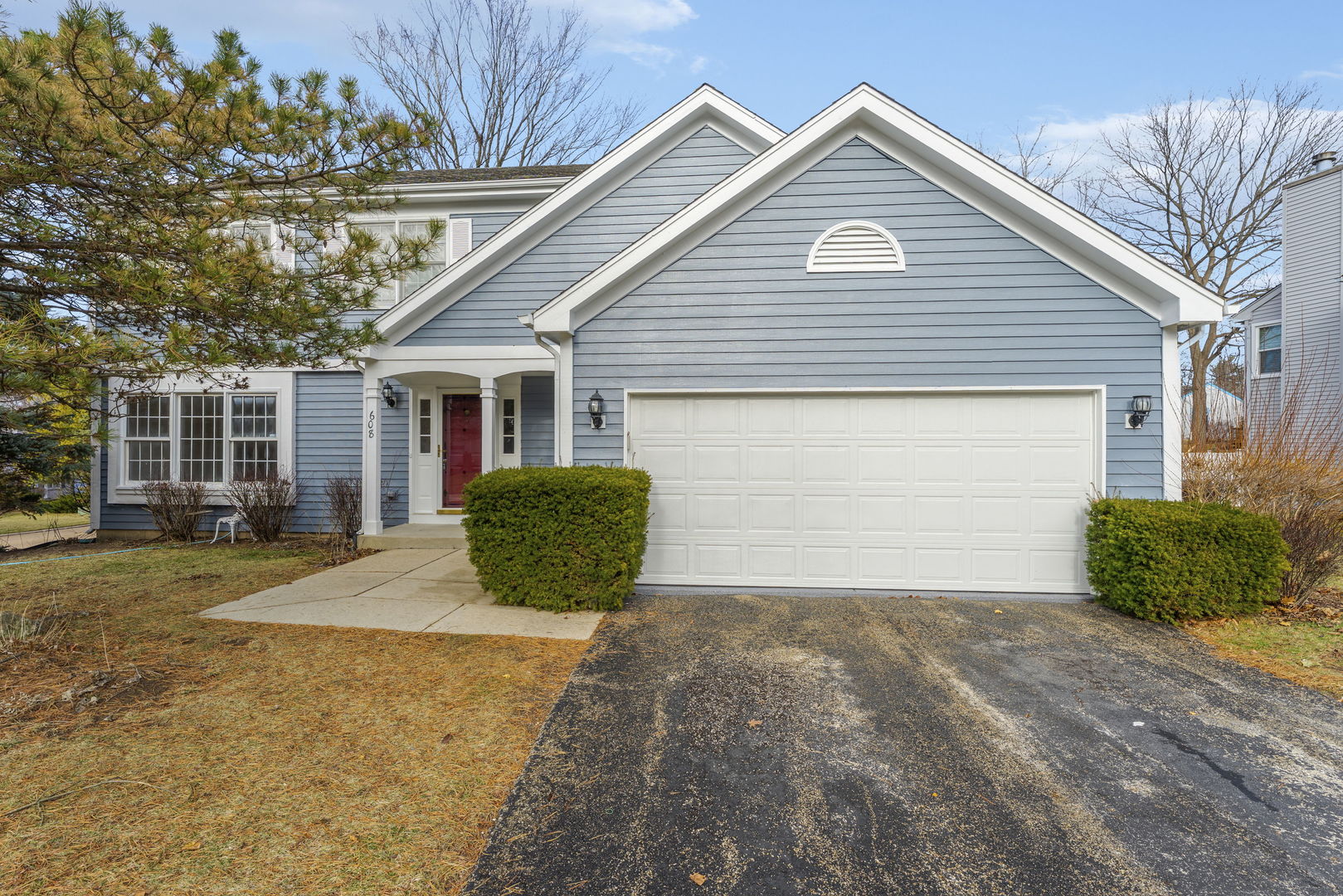 608 Carriage Hill Road Island Lake, IL 60042 - Photo 25 of 28 a view of a house with a yard and garage
