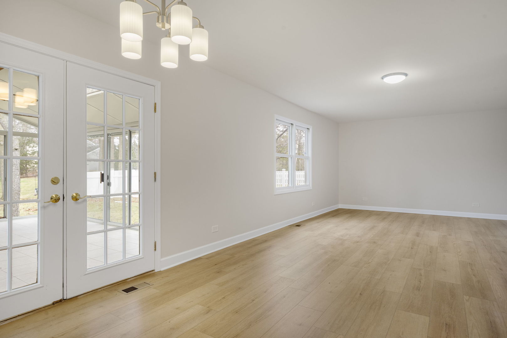 608 Carriage Hill Road Island Lake, IL 60042 - Photo 3 of 28 a view of an empty room with a window