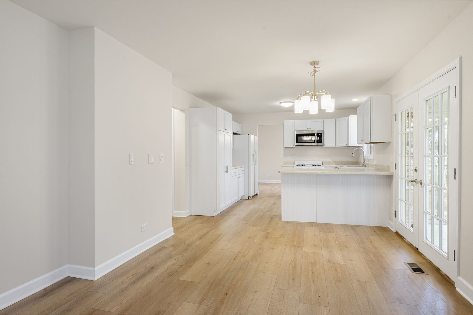 608 Carriage Hill Road Island Lake, IL 60042 - Photo 10 of 28 a view of kitchen with granite countertop cabinets and refrigerator
