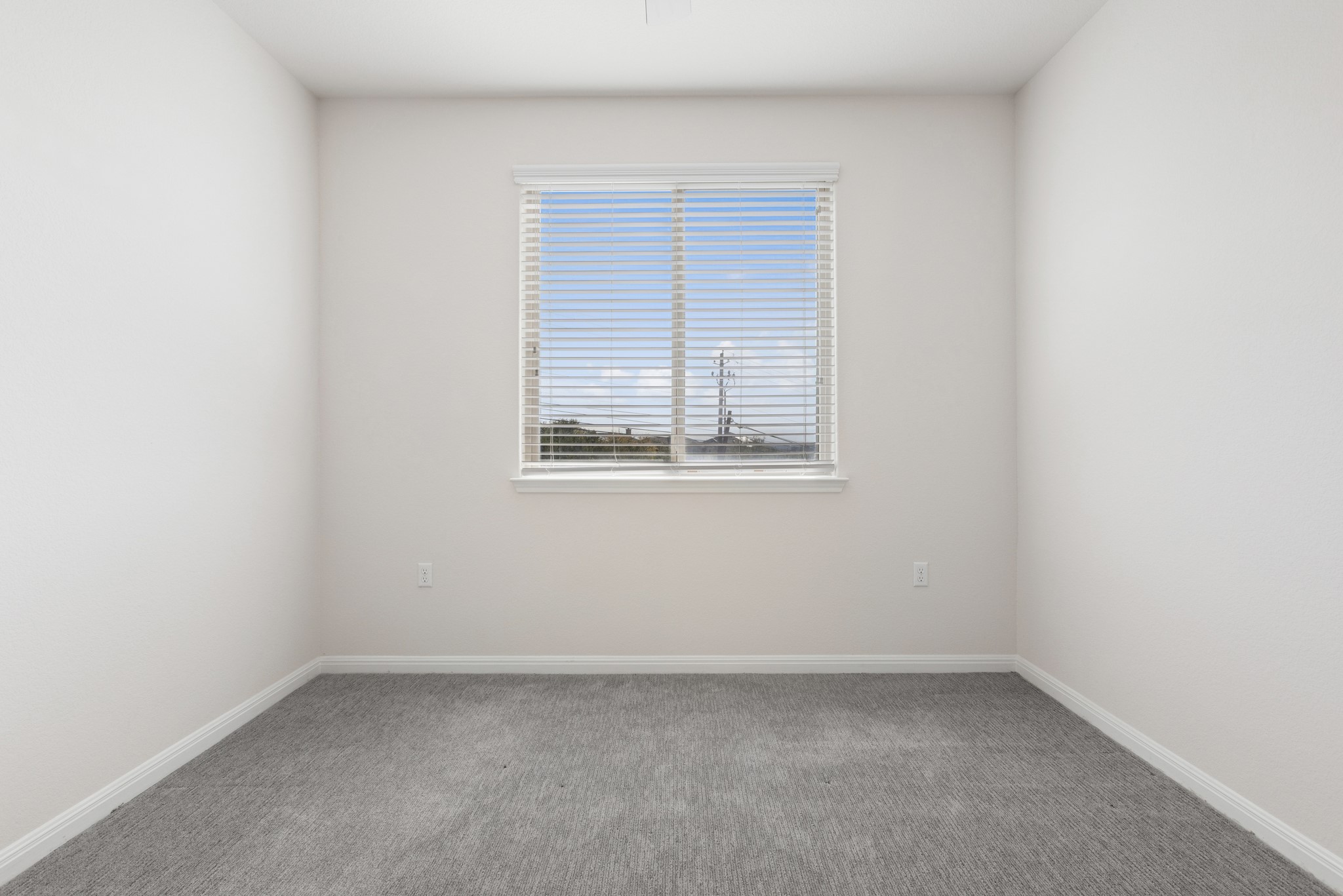 6104 Steep Cactus Trail Austin, TX 78735 - Photo 15 of 17 This room features light gray carpeting, white walls, and a window with horizontal blinds