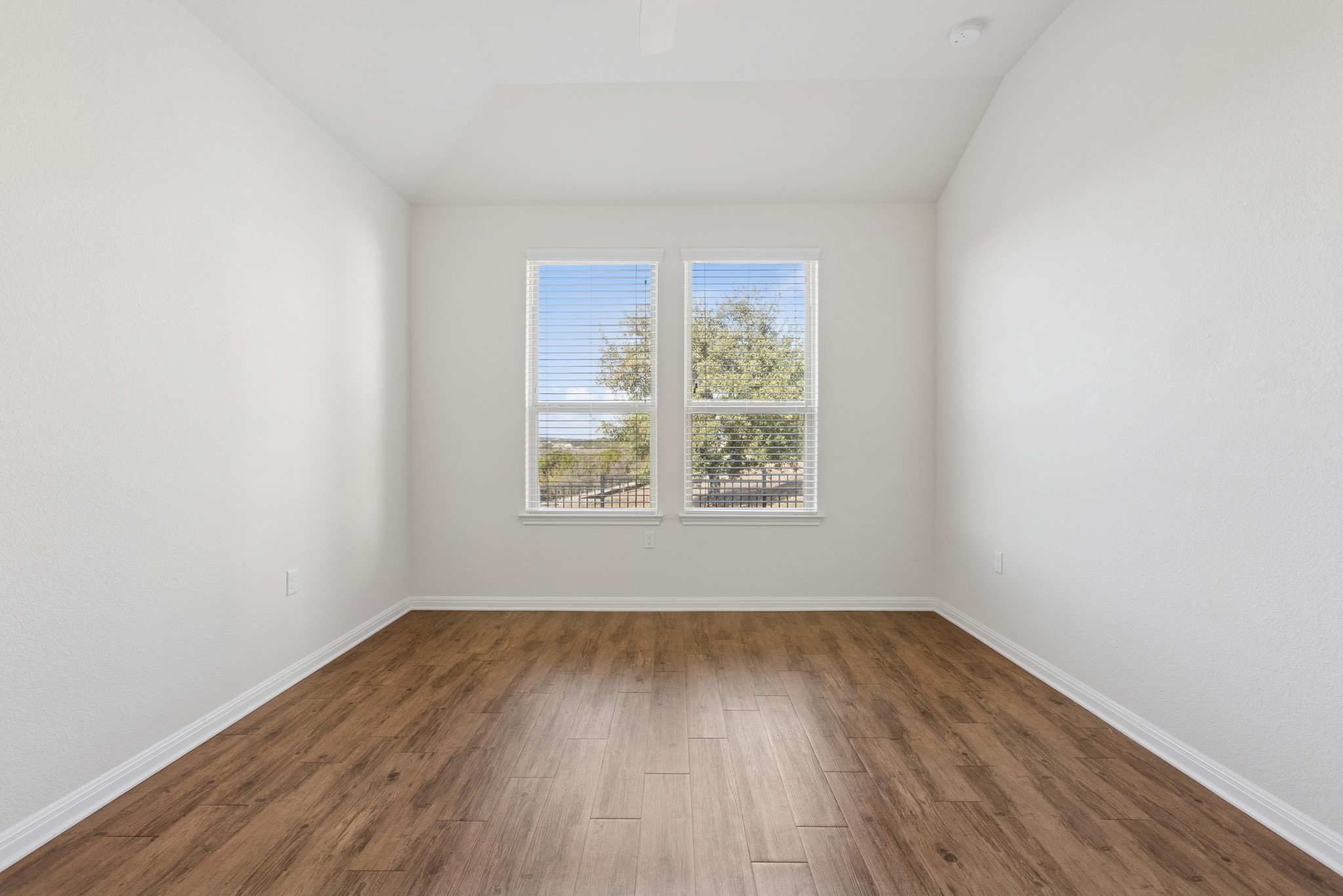 6104 Steep Cactus Trail Austin, TX 78735 - Photo 8 of 17 Room with wood plank flooring and white walls