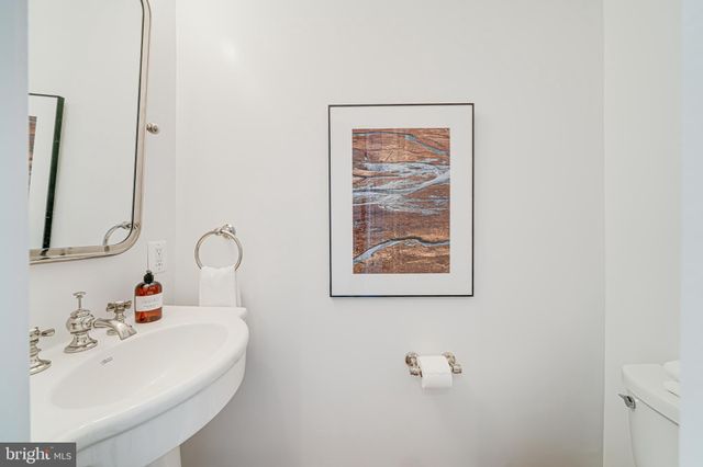 a view of a livingroom with furniture and a potted plant