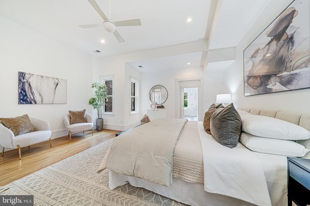 a spacious bathroom with double vanity and a bathtub