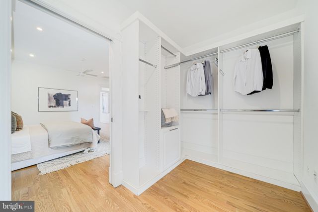 a bedroom with a bed and a table