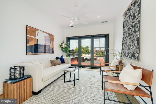 a bedroom with a bed and a potted plant