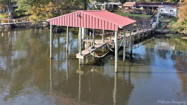 a small pool is sitting in the middle of a lake