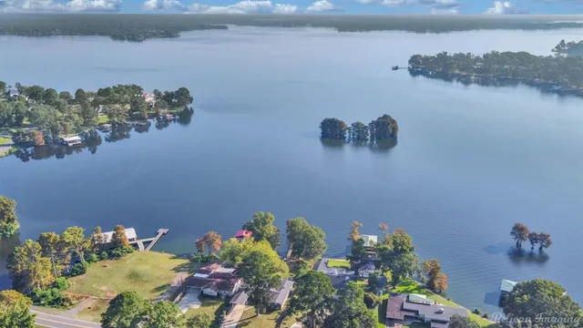 a view of table and chairs in a lake