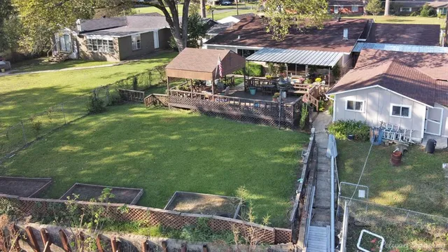 a front view of house with yard and outdoor seating