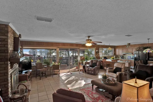 a living room with lots of furniture and a large window