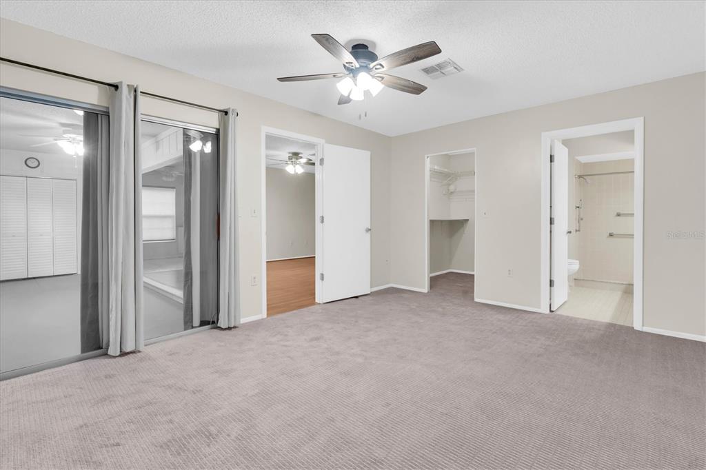 4814 Grist Mill Circle New Port Richey, FL 34655 - Photo 22 of 63 a view of empty room with a ceiling fan