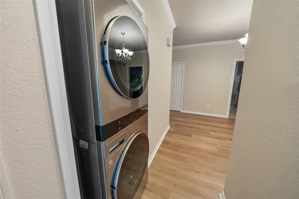 a view of a hallway with washer and dryer