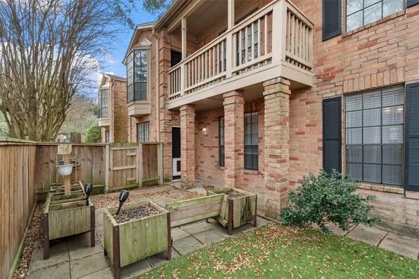a view of a patio with couches chairs and a fire pit