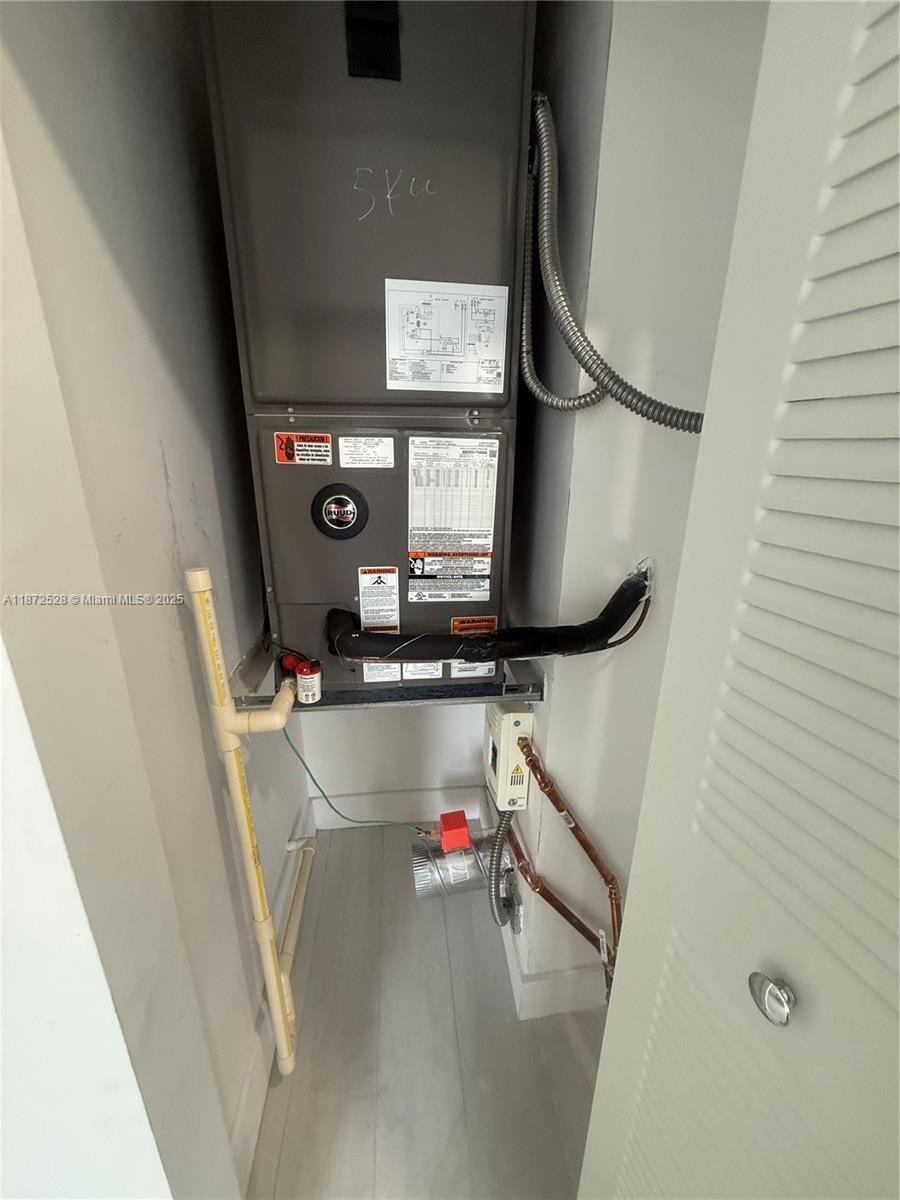 1091 East 17th Street, Unit 304 Hialeah, FL 33010 - Photo 20 of 25 a room with wooden floor and window