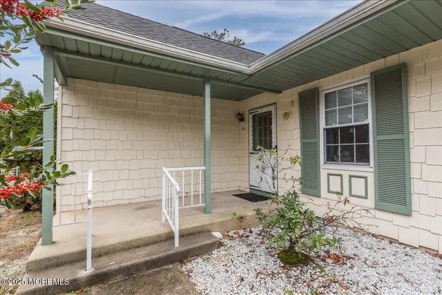 a front view of a house with a porch