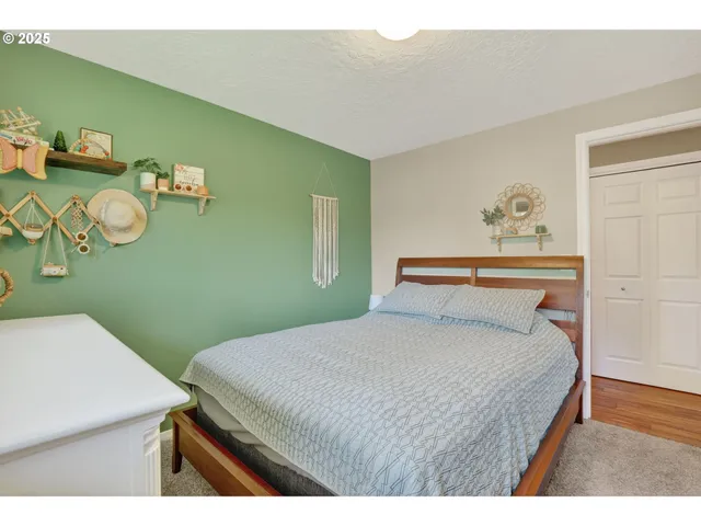 a bedroom with a bed and a table