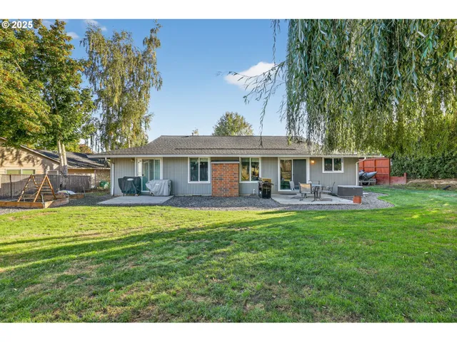 a front view of a house with swimming pool having outdoor seating