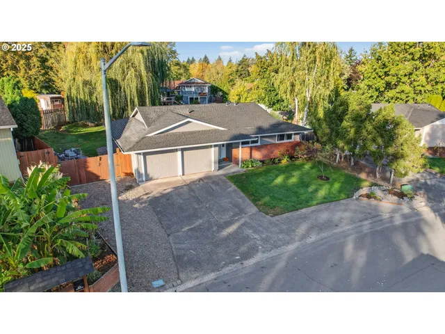 a backyard of a house with lots of green space