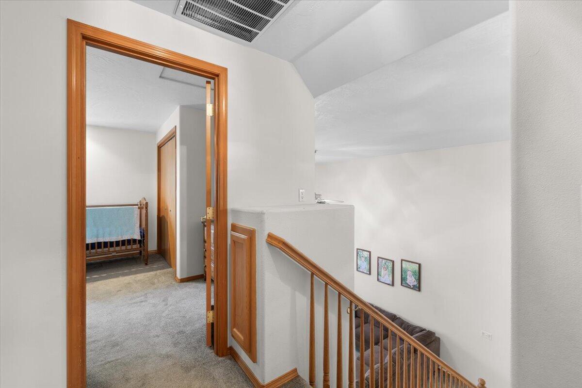 752 Mallory Court Central Point, OR 97502 - Photo 23 of 32 a view of a hallway with entryway and stairs