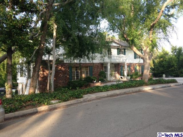 Undisclosed Address Pasadena, CA 91105 - Photo 2 of 50 a view of a house with a tree and a yard
