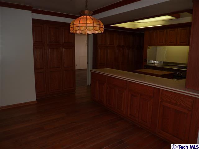 Undisclosed Address Pasadena, CA 91105 - Photo 13 of 50 a room with wooden floor and chandelier