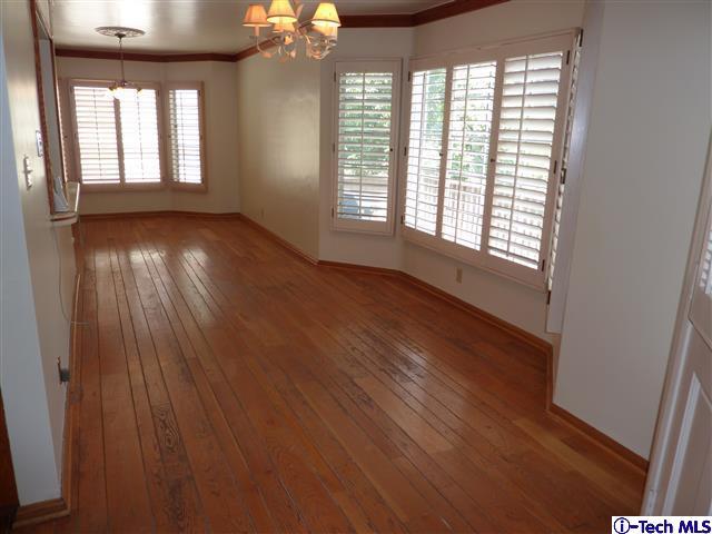 Undisclosed Address Pasadena, CA 91105 - Photo 14 of 50 a view of an empty room with wooden floor and a window