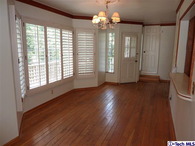 Undisclosed Address Pasadena, CA 91105 - Photo 17 of 50 a view of a livingroom with wooden floor and a large window