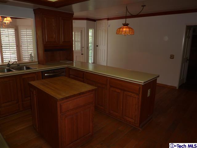 Undisclosed Address Pasadena, CA 91105 - Photo 18 of 50 a kitchen with a sink and a refrigerator