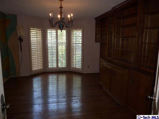 Undisclosed Address Pasadena, CA 91105 - Photo 21 of 50 an empty room with wooden floor and windows