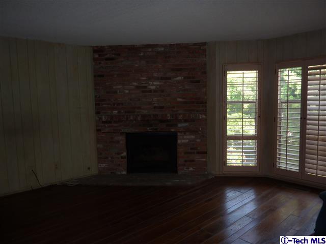 Undisclosed Address Pasadena, CA 91105 - Photo 22 of 50 a view of an empty room with wooden floor and a window